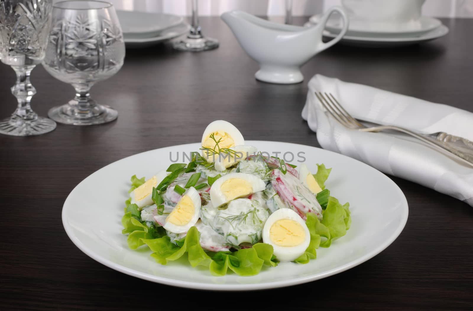 Radish salad with cucumber and quail eggs for milk sauce