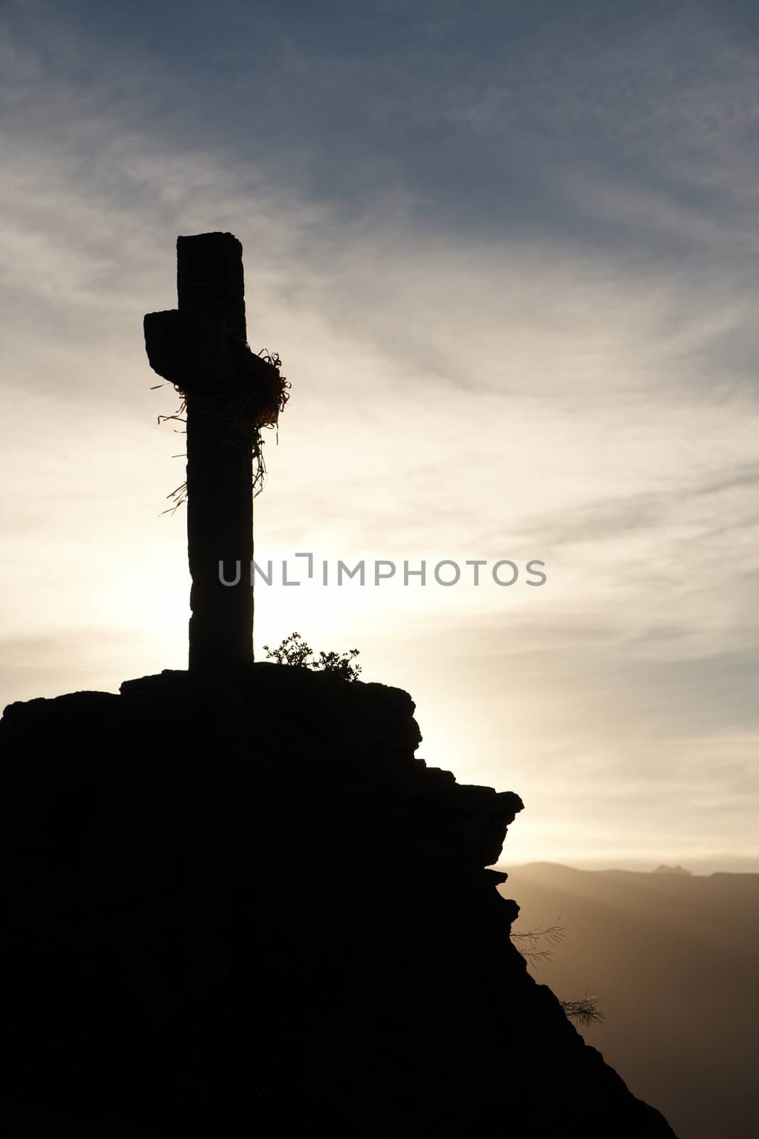Lonely cross at dawn