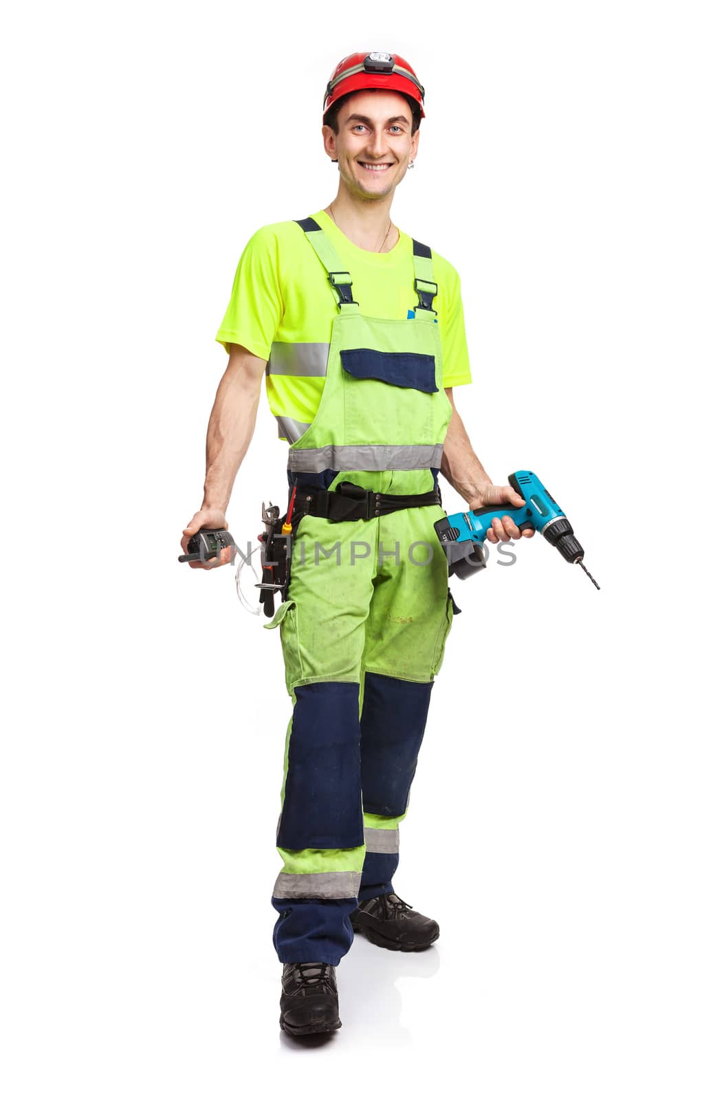 Handsome contractor holding electric screwdriver by photobac