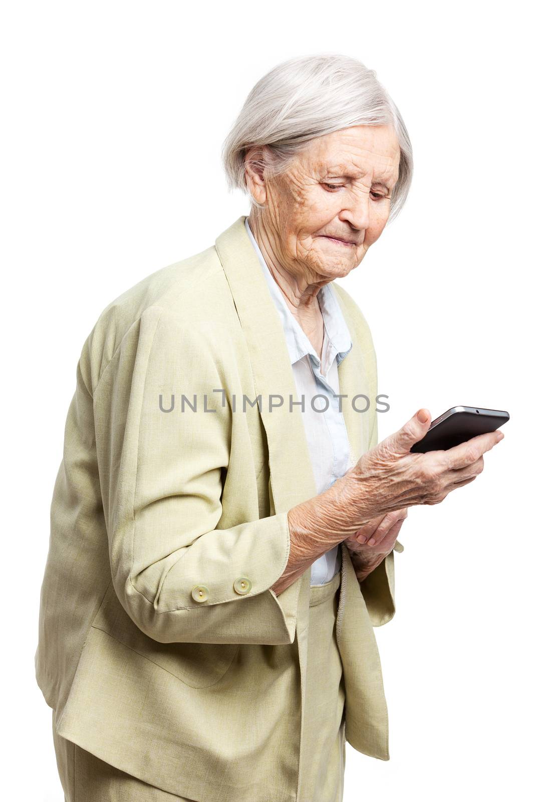 Senior woman using mobile phone by photobac