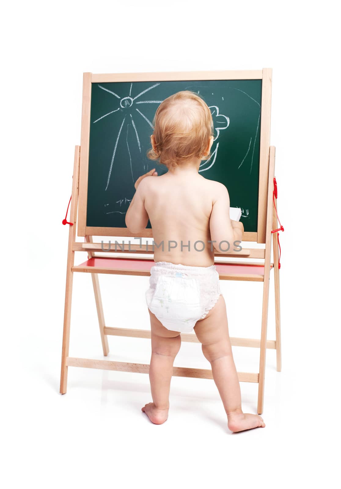 Baby boy drawing on chalkboard over white background