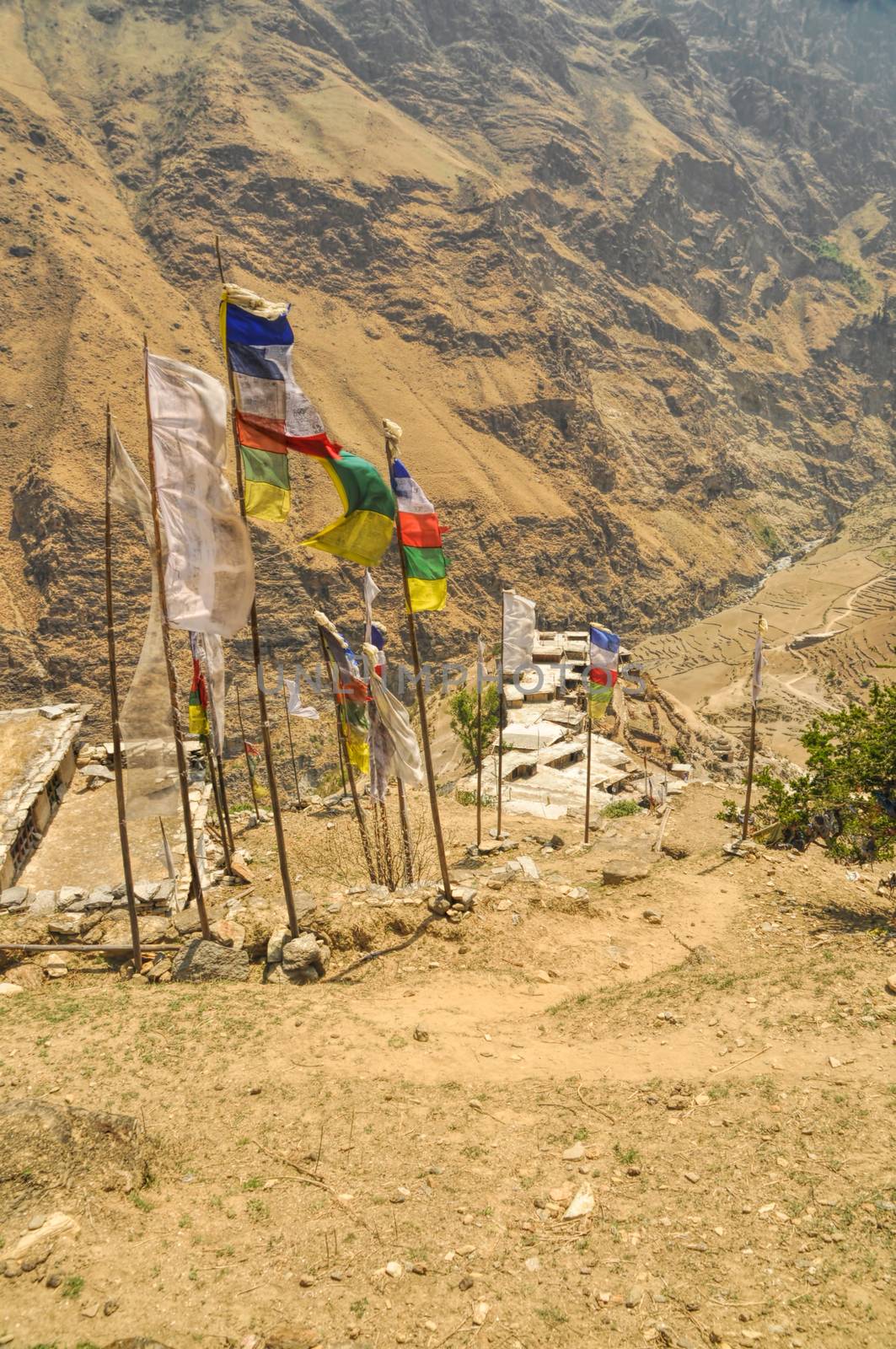 Picturesque view of prayer flags near old traditional Nepalese village