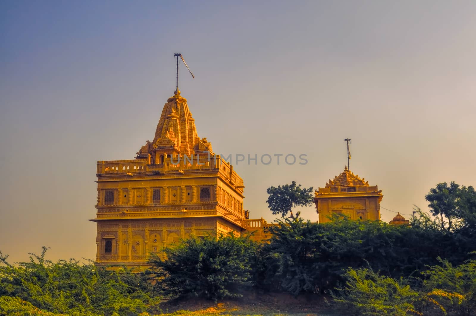 Picturesque view of temple in Thar Desert illuminated by the setting sun