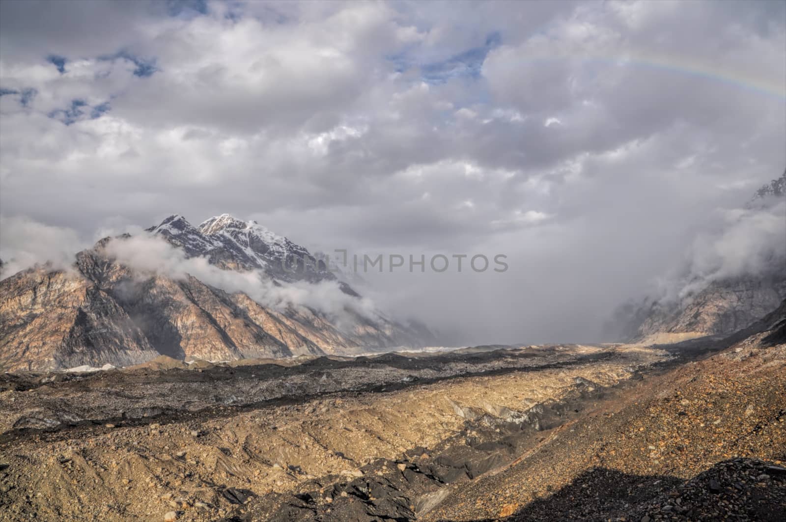 Dramatic clouds forming on Engilchek glacier in Tian Shan mountain range in Kyrgyzstan