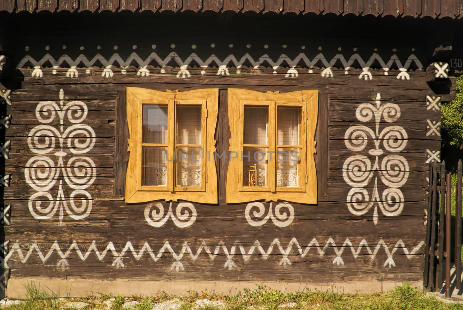 Painted facade of traditional wooden house in Slovakia in famous village of Cicmany