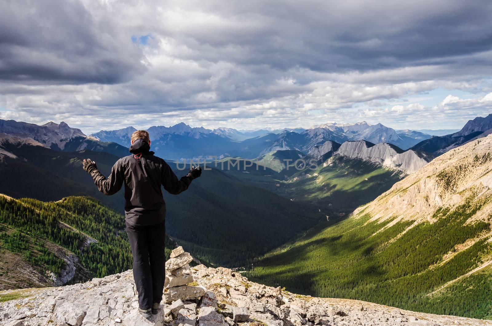 Man enjoying view of Jasper NP mountain range, Alberta, Canada