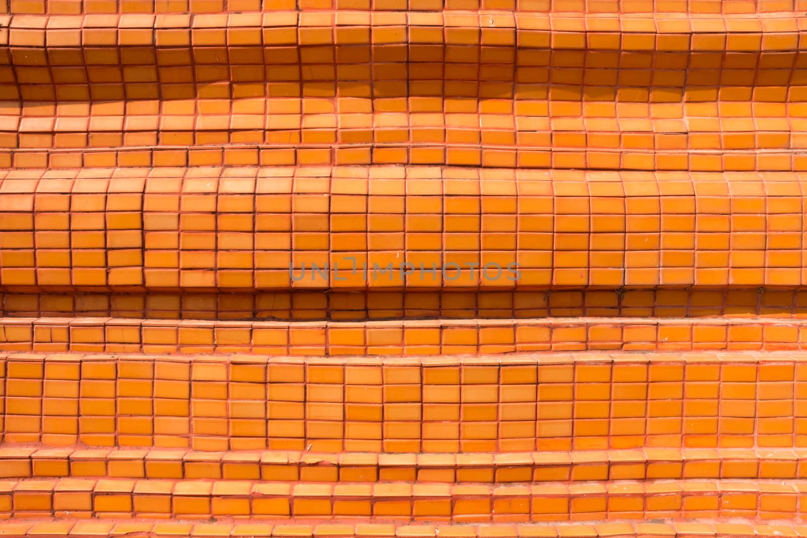 Orange tiled wall for background
