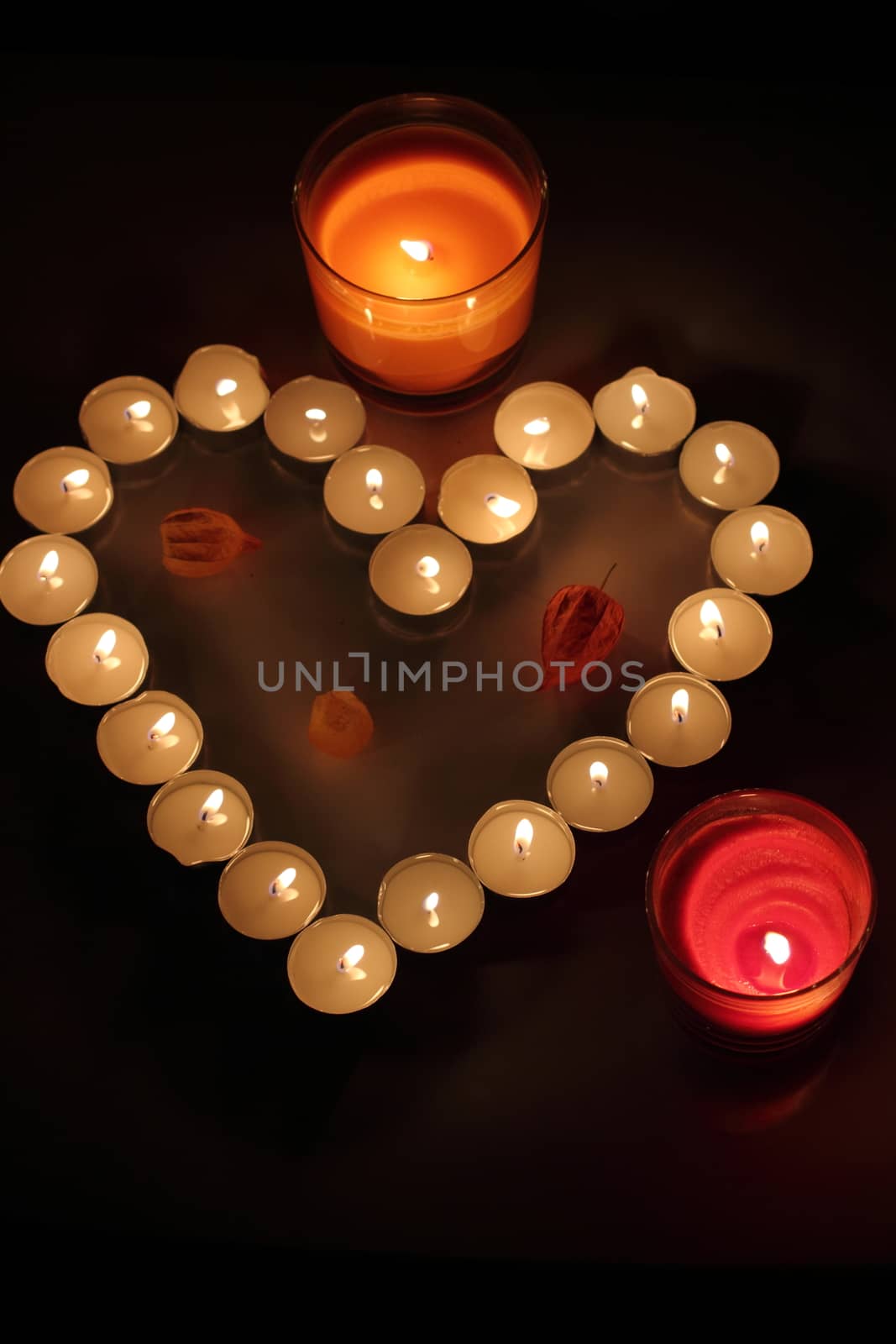 Heart of candles, a sign of love. romantic evening