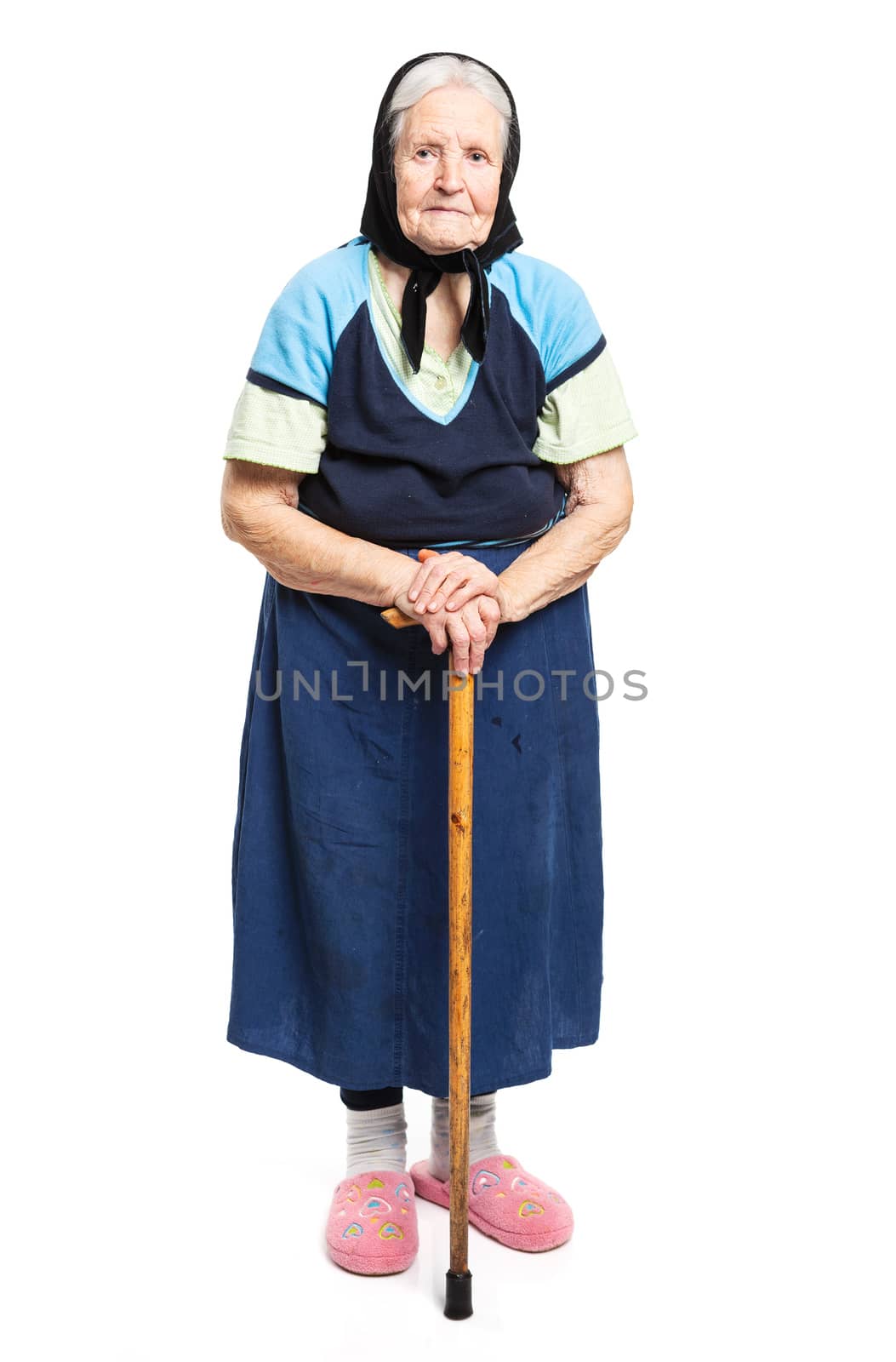 Old woman with a cane over white by photobac