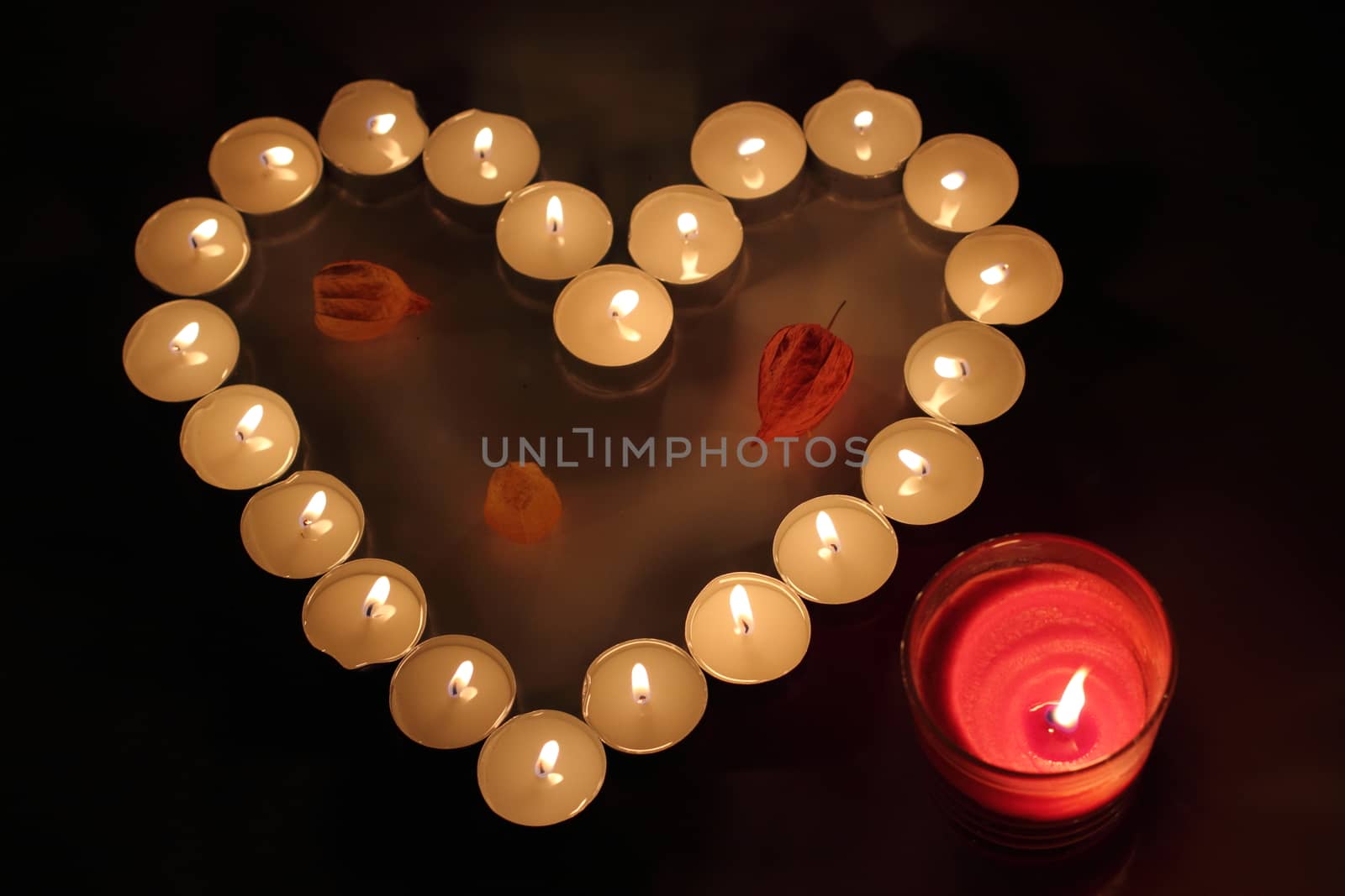 Heart of candles, a sign of love. romantic evening