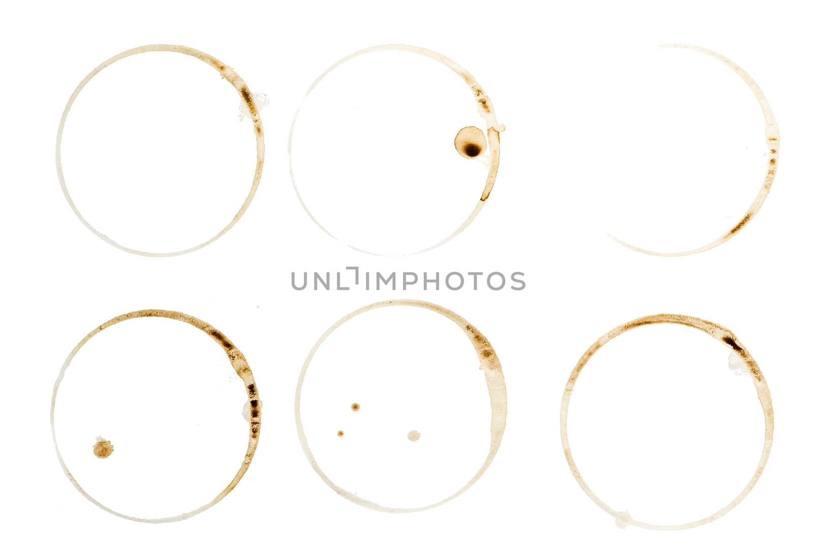 Lot of circle shape coffee stains on white background.