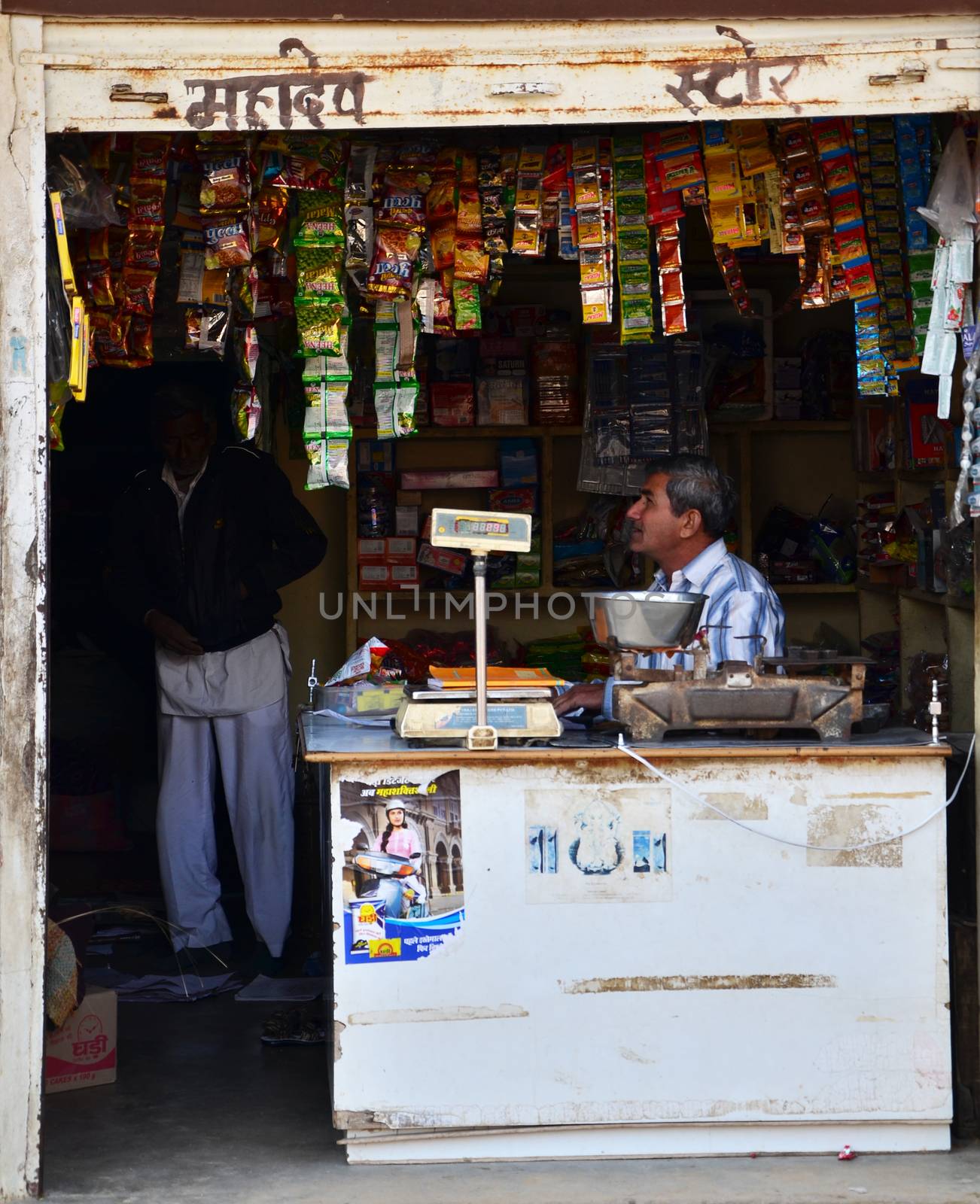 Jodhpur, India - January 1, 2015: Unidentified Indian man selling snack at market in Jodhpur, India. Jodhpur is famously known as the blue city.