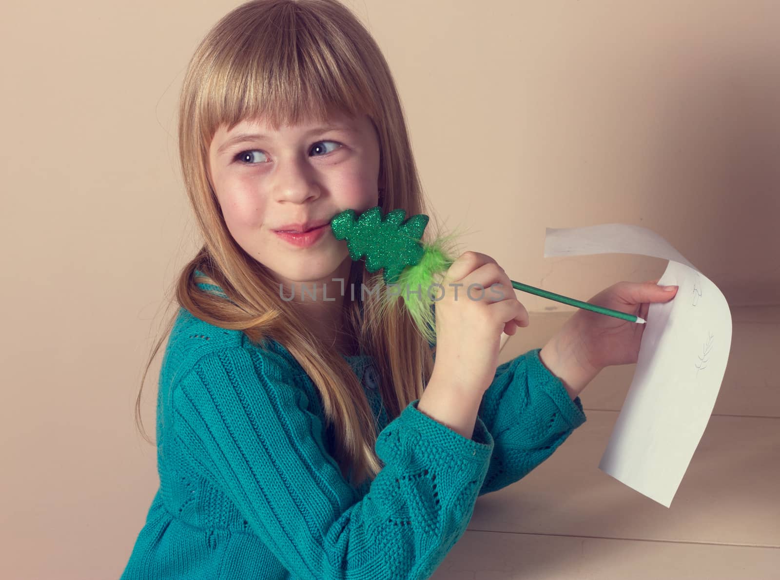 family, children and happy people concept - little girl drawing