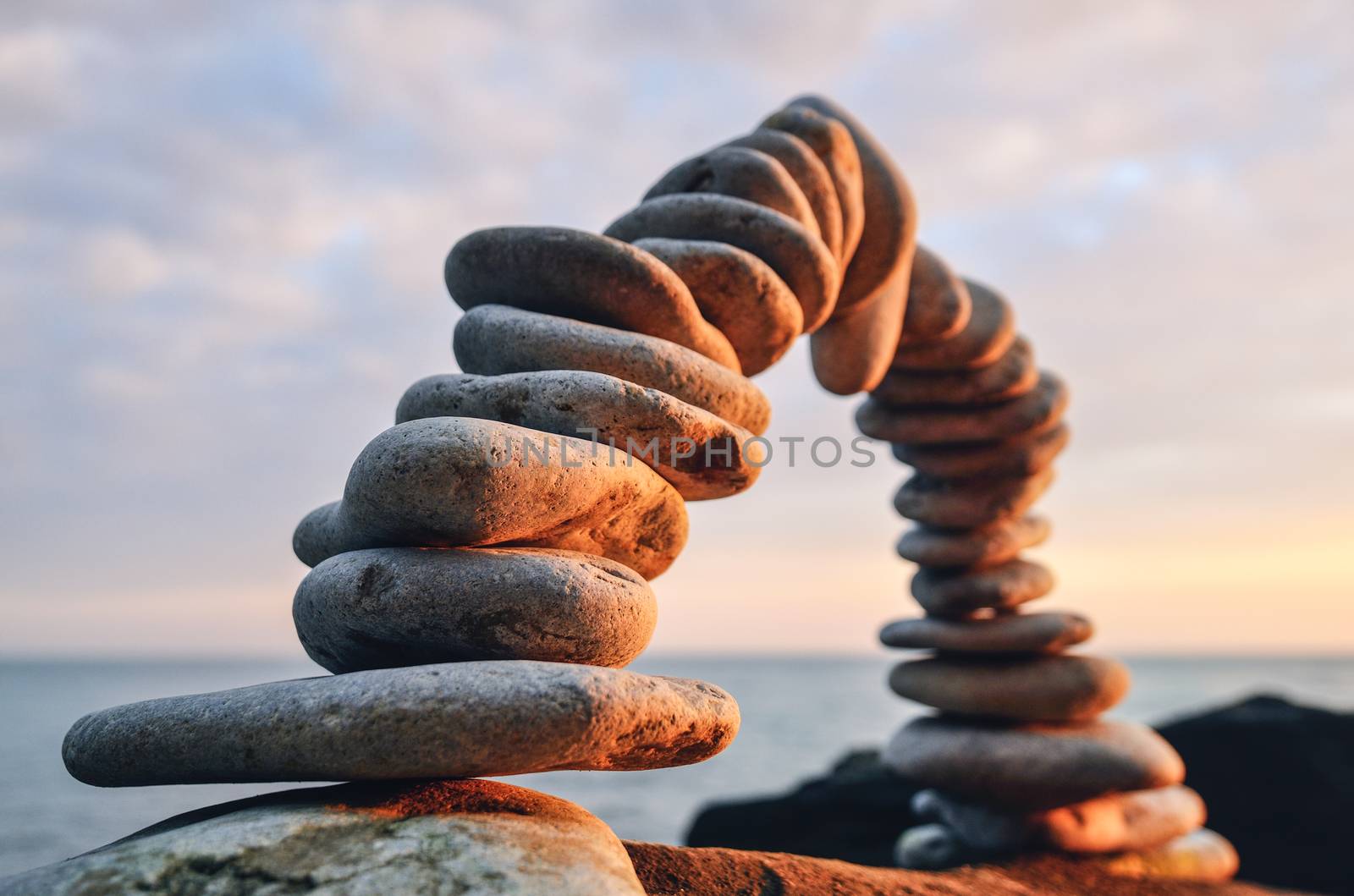 Stones laid out in the form of a arc on the seashore