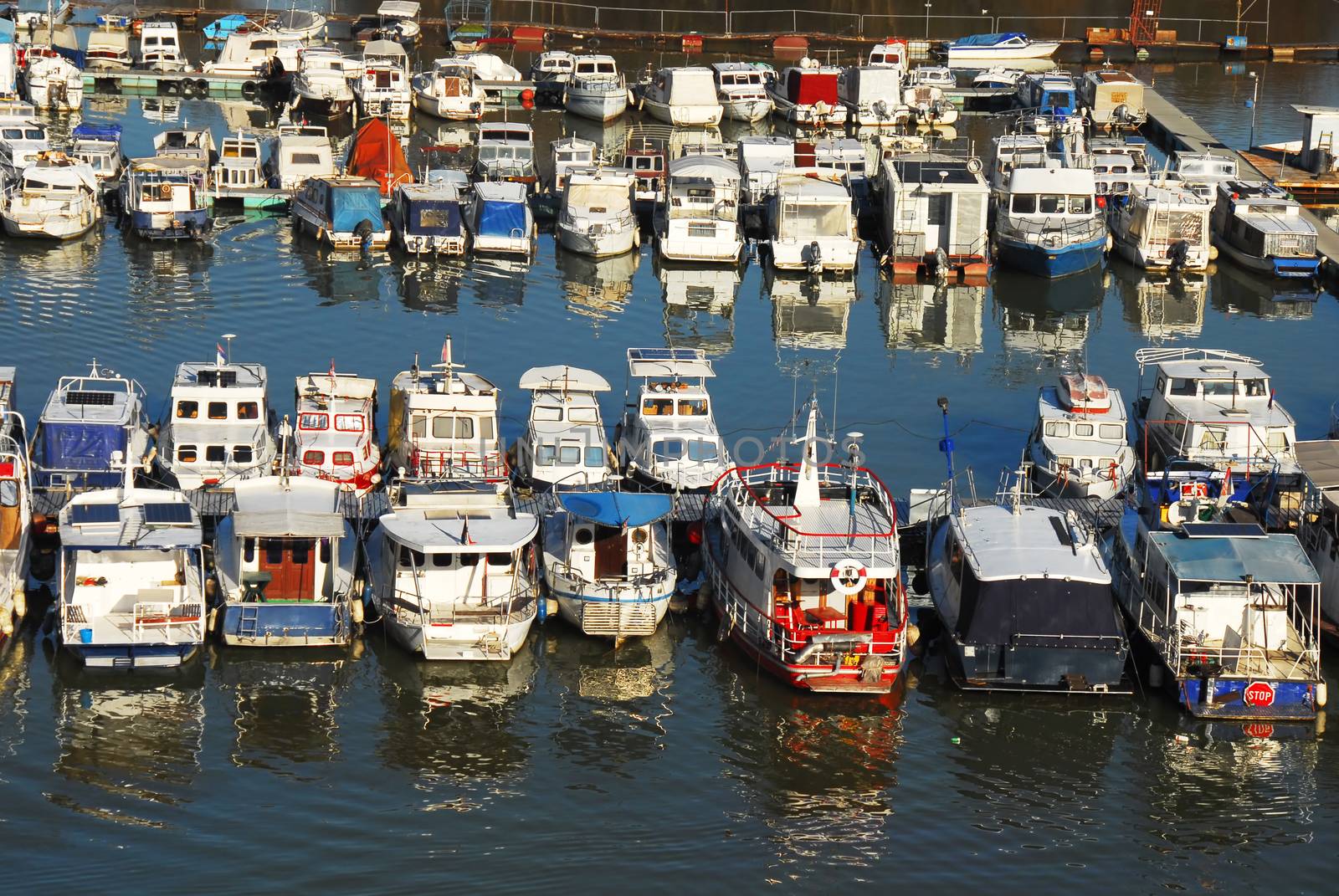 various parked boats in row on Sava river in Belgrade, Serbia