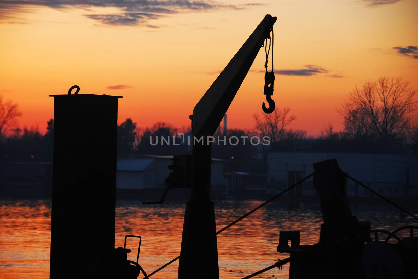 boat cran and sunset at Sava river in Belgrade, Serbia