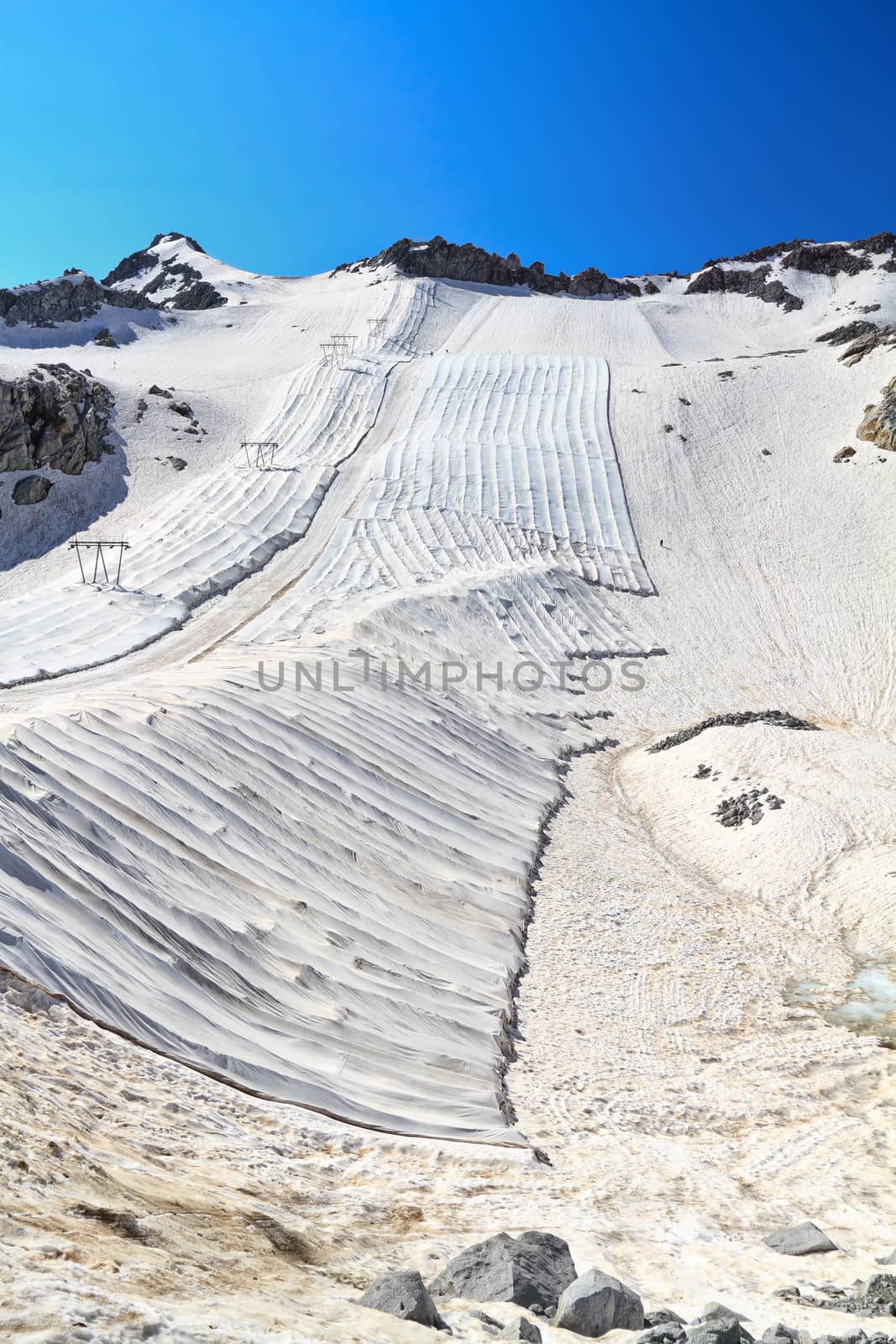 summer view in Presena glacier  with geotextile fabrics, Italian Alps