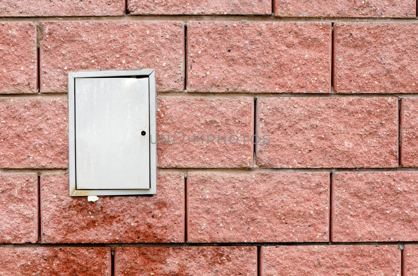 Red wall with white switchboard doors and wet part.