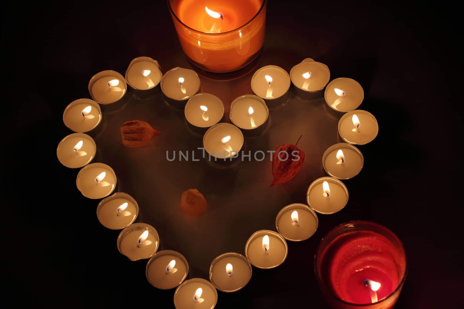 Heart of candles, a sign of love. romantic evening