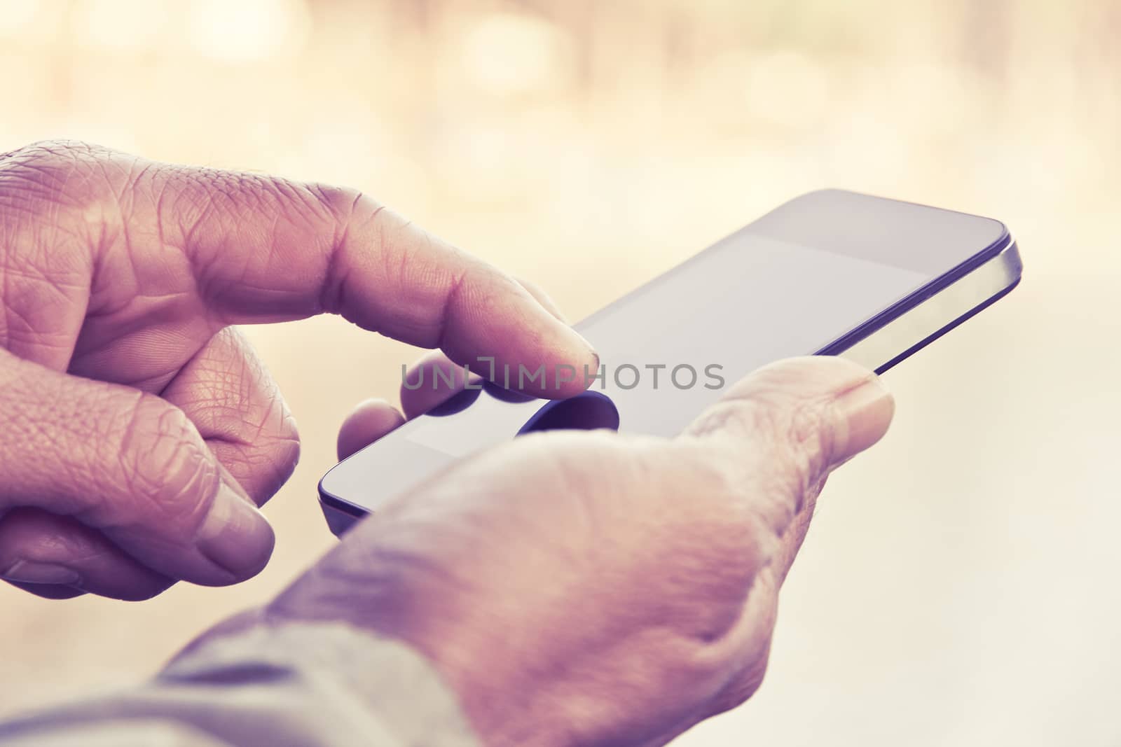 Man texting on his smartphone