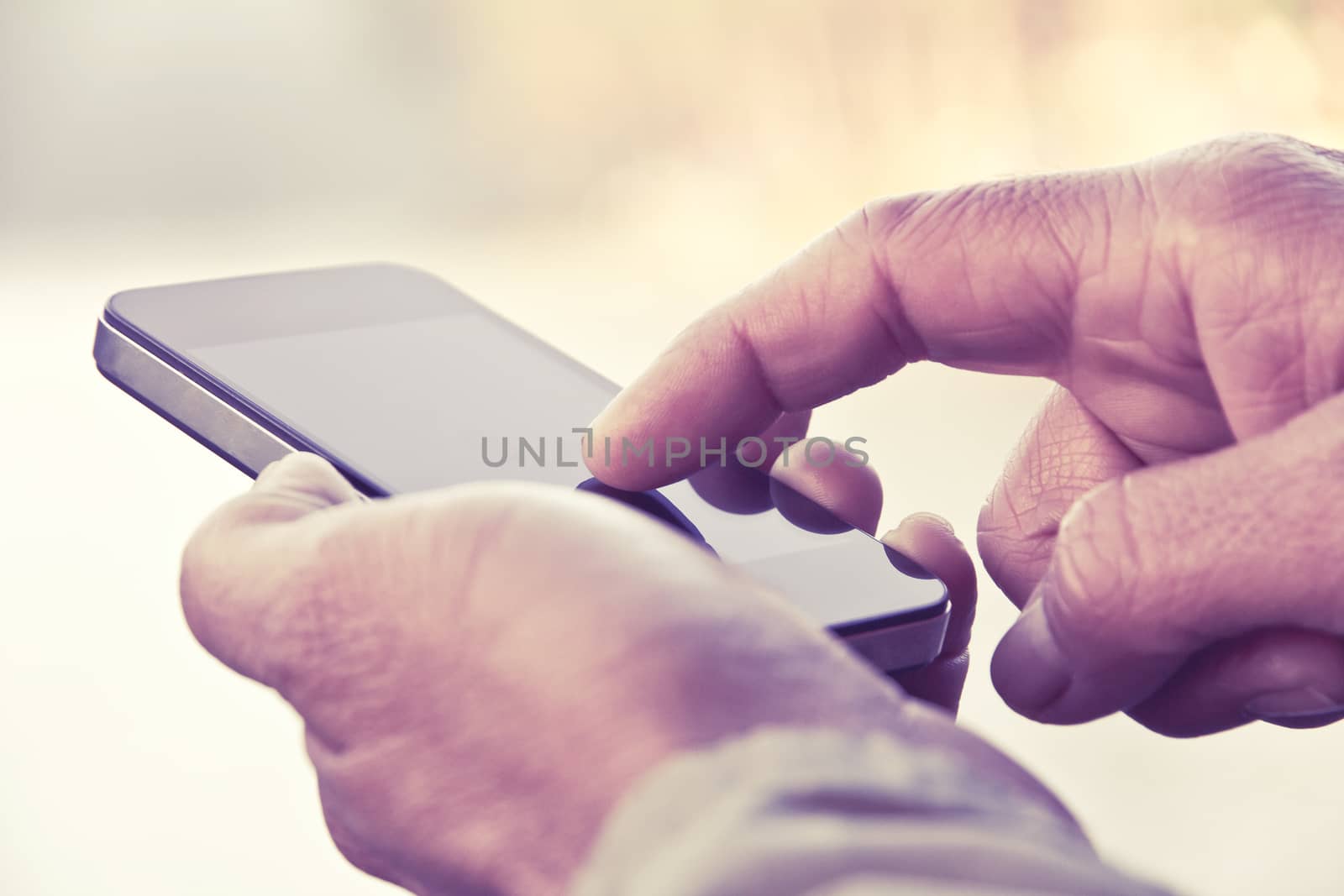 Man texting on his smartphone