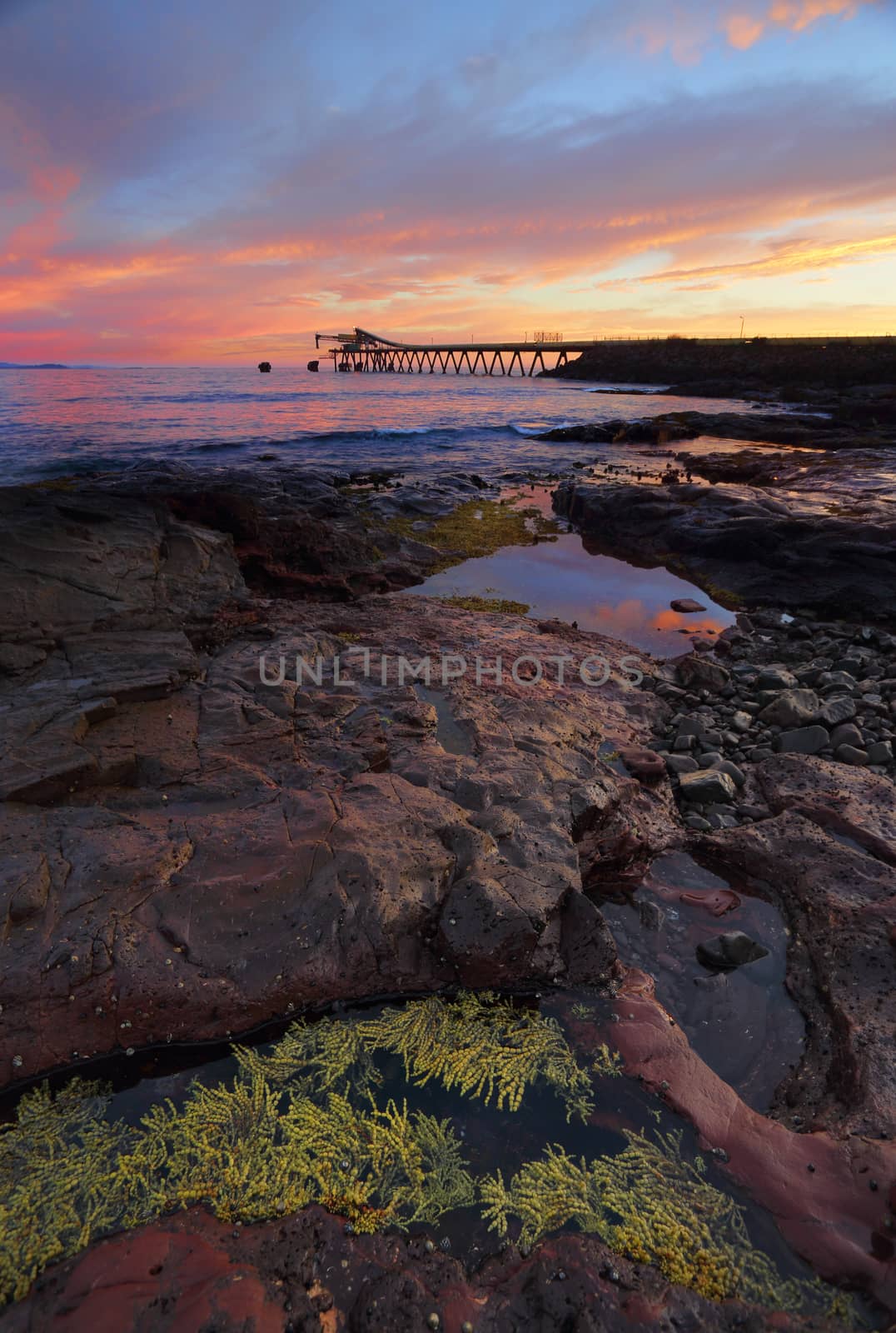 Sunrise from Bass Point with Gravel Loader pier in distance by lovleah