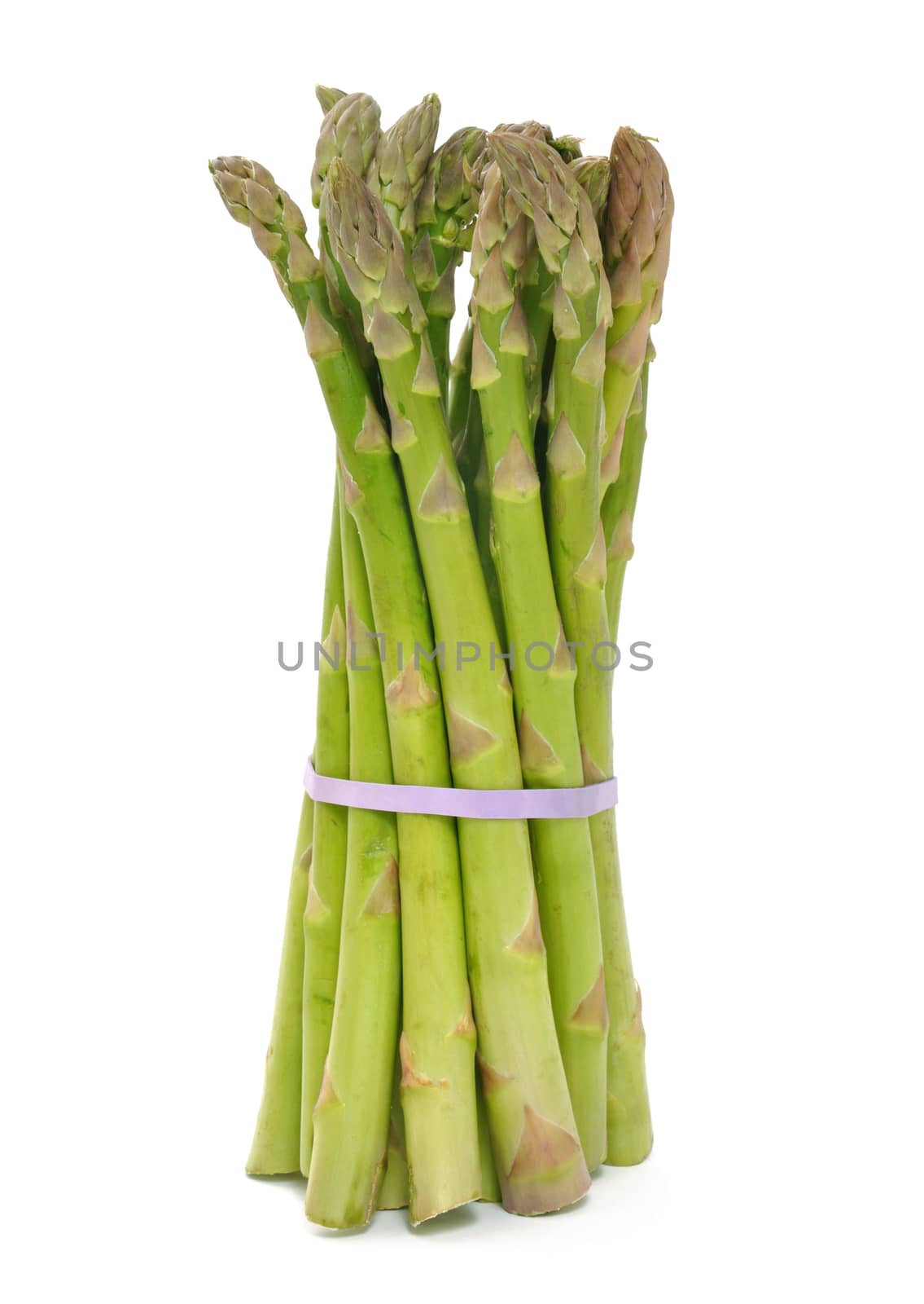Bunch of asparagus standing against a white background