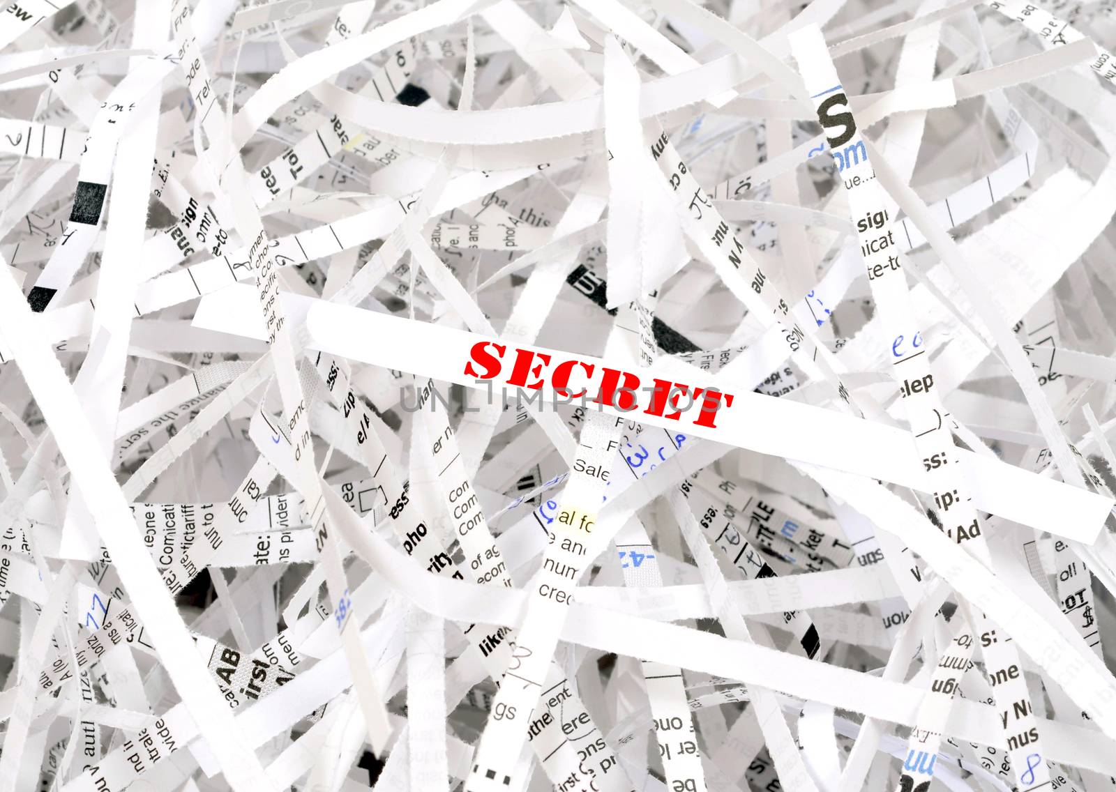 Secret text surrounded by shredded paper. Great concept for information protection