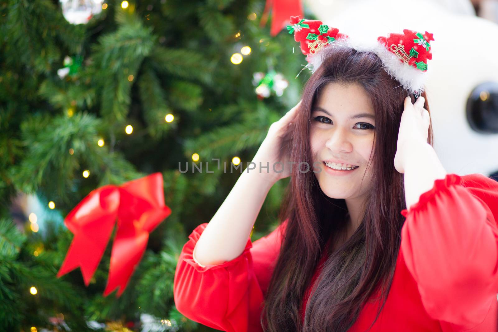 Happy and smile santa woman.relax and smile in christmas day.standing near tree chirstmas and gift.