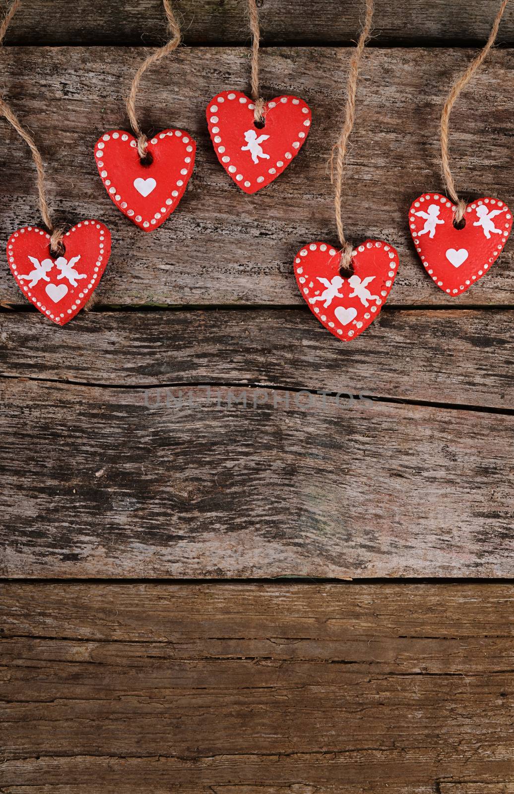 The hearts on wooden background. Valentine's day