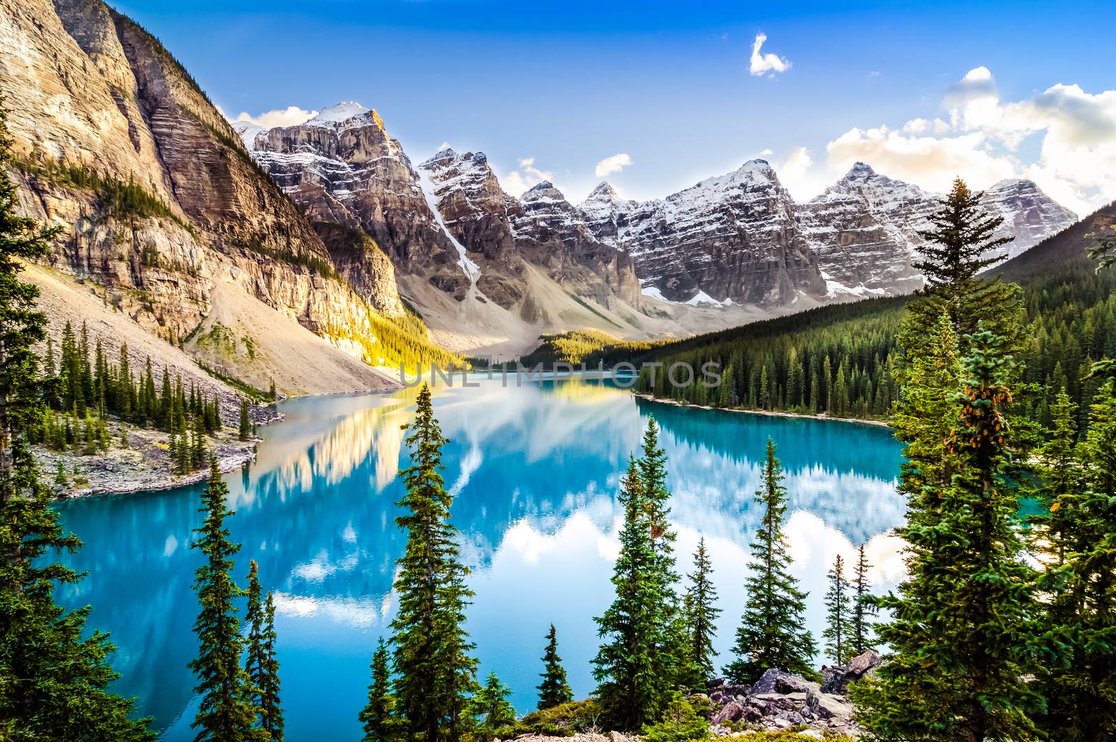 Landscape view of Moraine lake and mountain range at sunset in Rocky Mountains, Canada