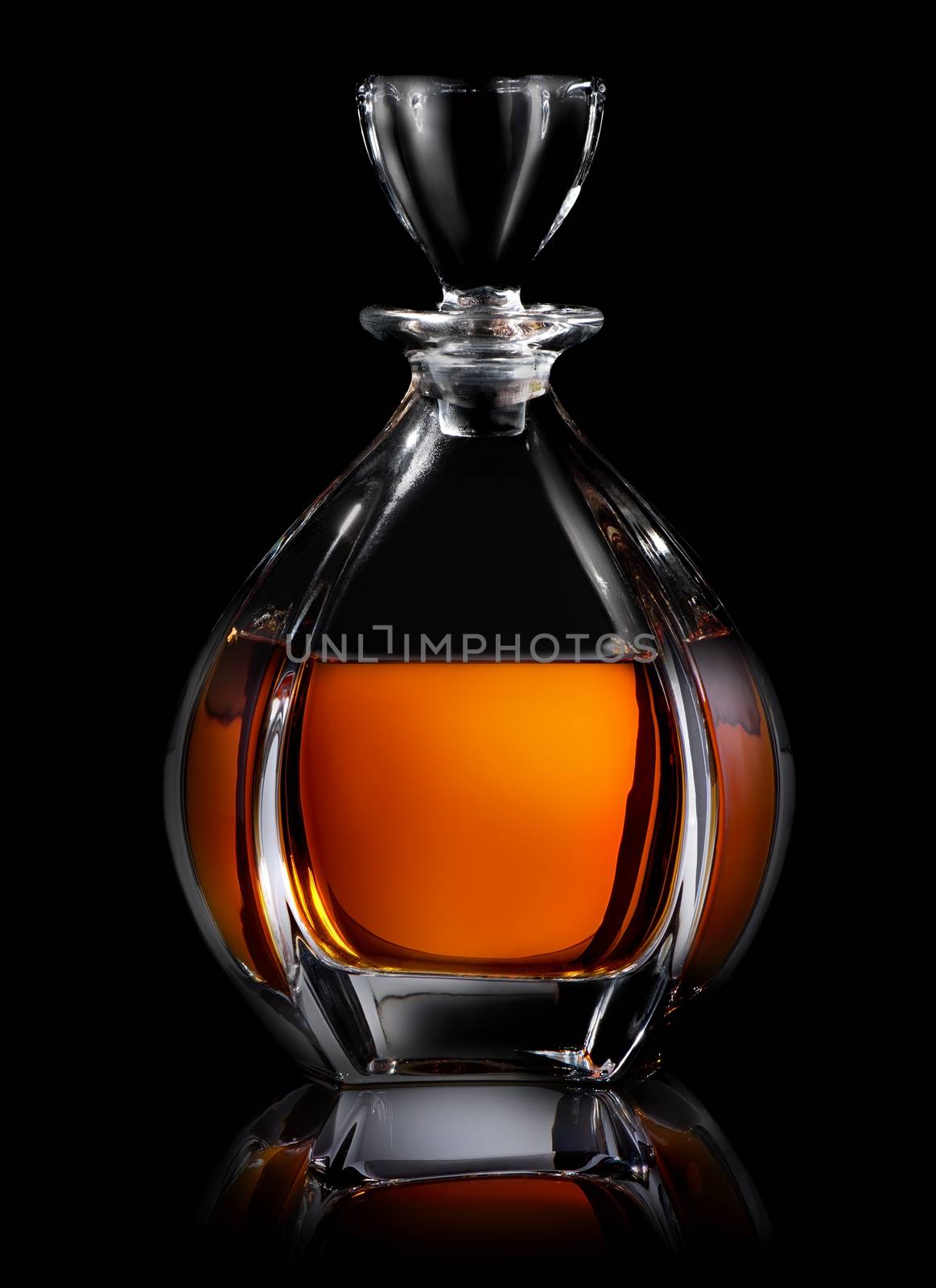 Decanter of cognac on a black background