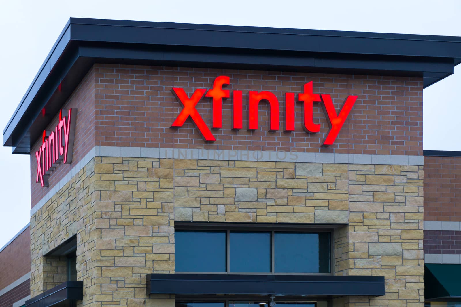 MAPLEWOOD, MN/USA - JANUARY 20, 2015: Xfinity retail store and sign. Xfinity provides cable television, broadband internet, and voip telephone.