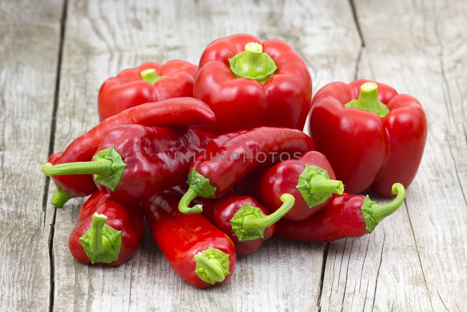 red peppers on wooden background