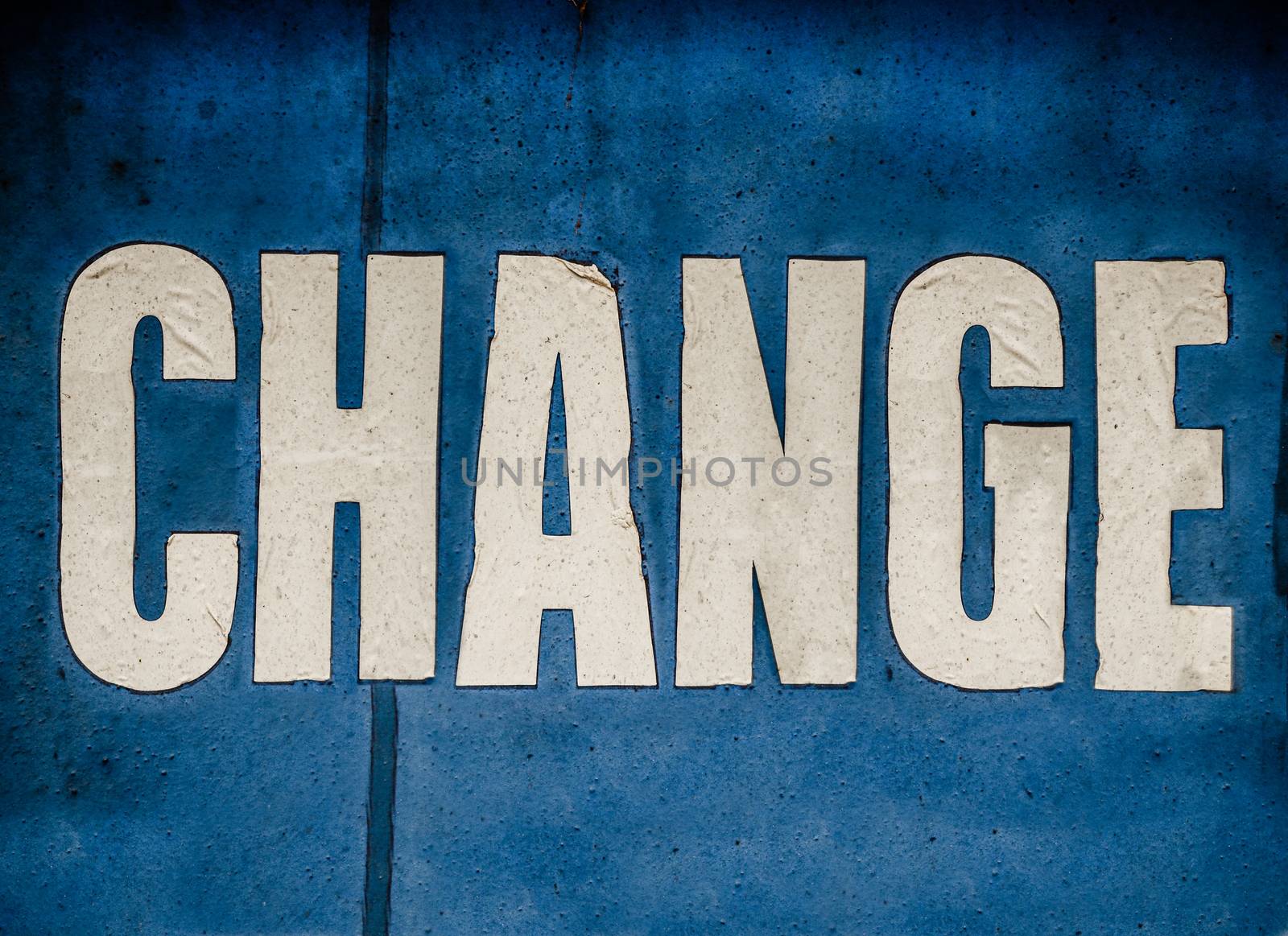 A Grungy Blue Conceptual Sign Saying Change In White Letters