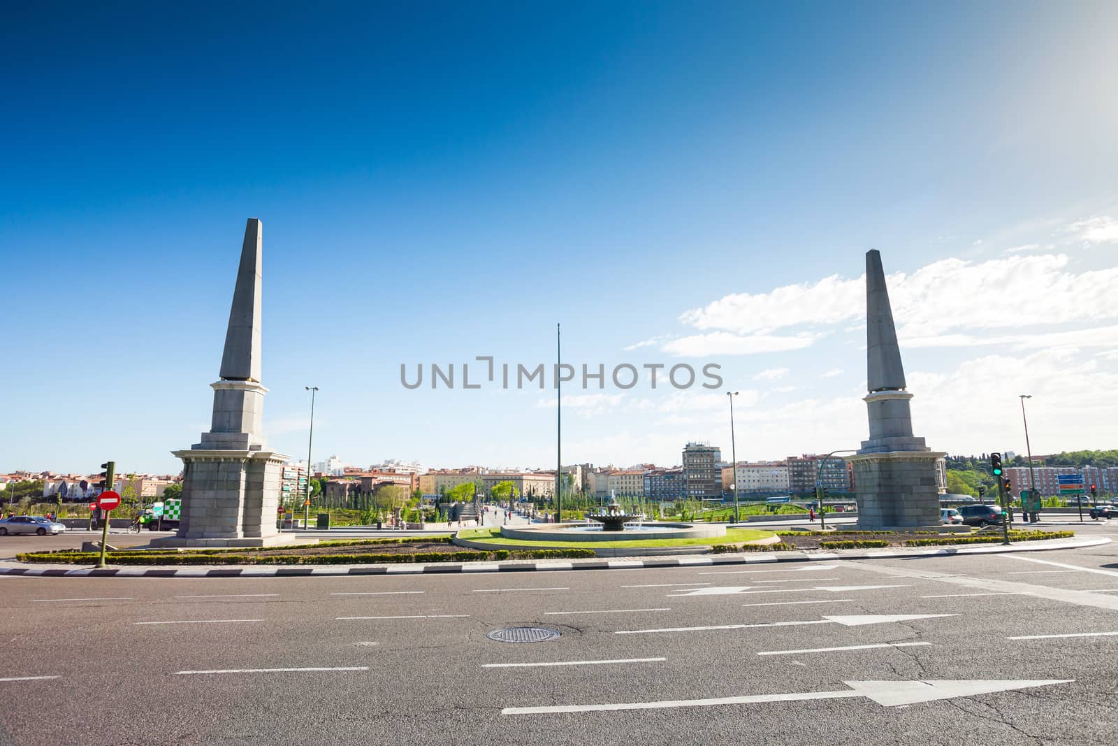 Madrid, Spain - May 5, 2012: Roundabout of the Pyramids ("Glorieta de las Pirámides") in front of Toledo Bridge on a sunny spring day, Madrid, Spain. It was built in XVII century.