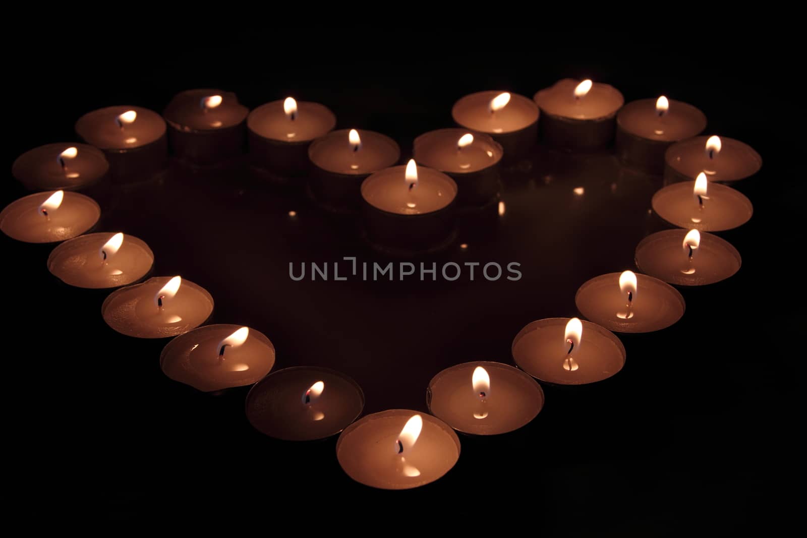 Heart of candles, a sign of love. romantic evening