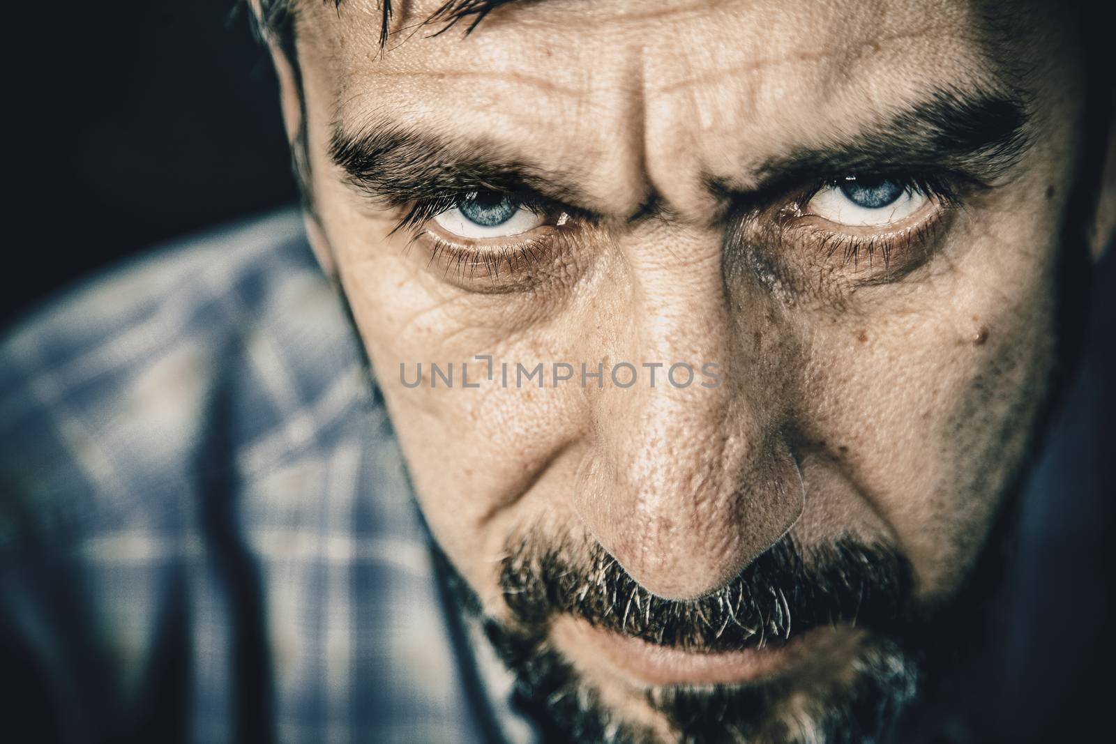 Portrait of a serious man with a beard