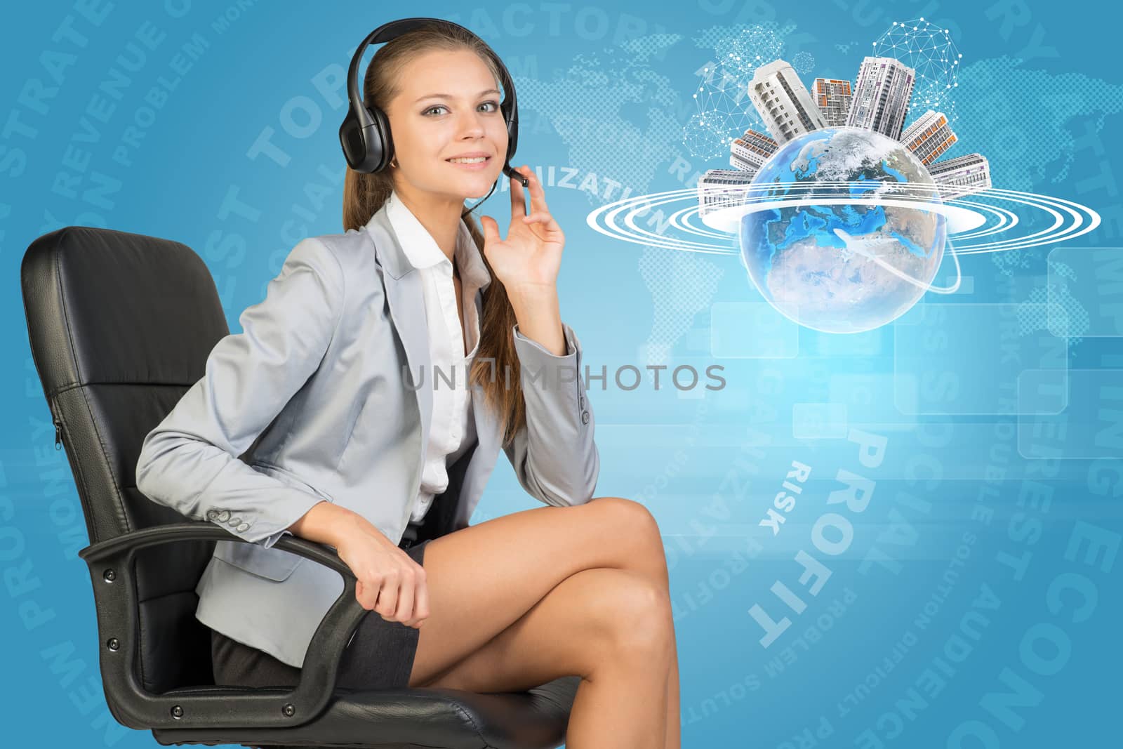 Businesswoman in headset, sitting on office chair, her hand on microphone, looking at camera, smiling. Globe with horisontal rings and buildings on top and flying aeroplane beside. Radiant text and other virtual elements as backdrop. Element of this image furnished by NASA