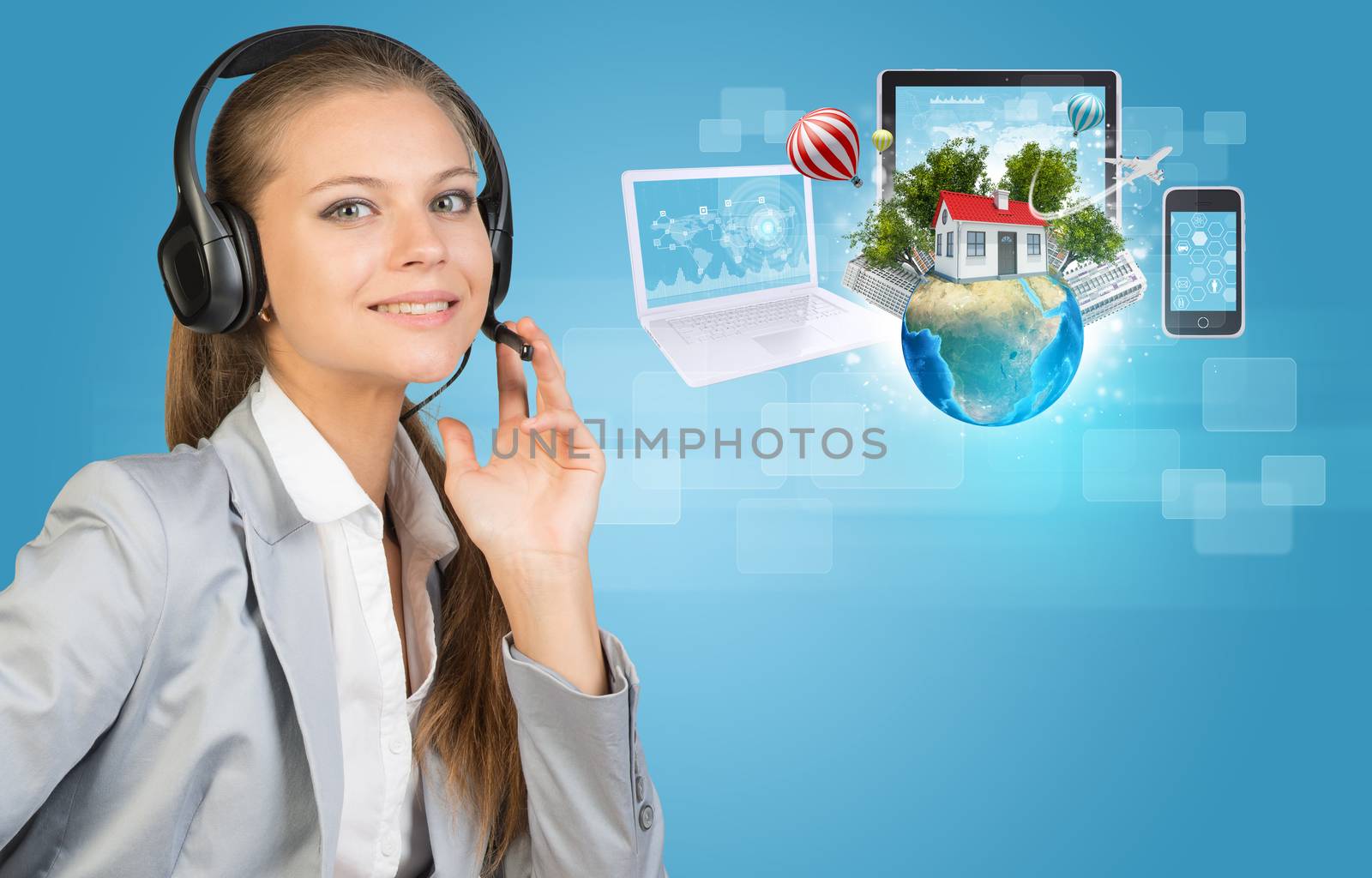 Businesswoman in headset, her hand on microphone, looking at camera, smiling. Beside are Globe with small house, high-rise buildings, trees, airplane and balloons, surrounded by computers and smartphone, on light blue background