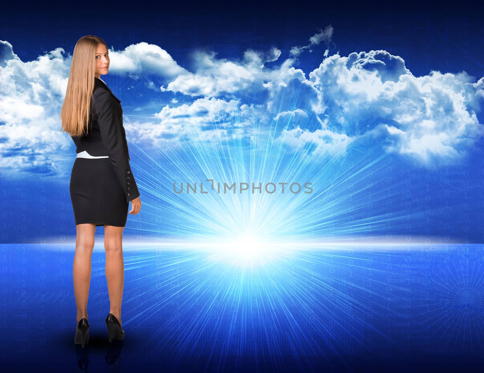 Businesswoman standing against digitally generated spacy blue landscape with rising sun and cloudy sky, looking back over her shoulder