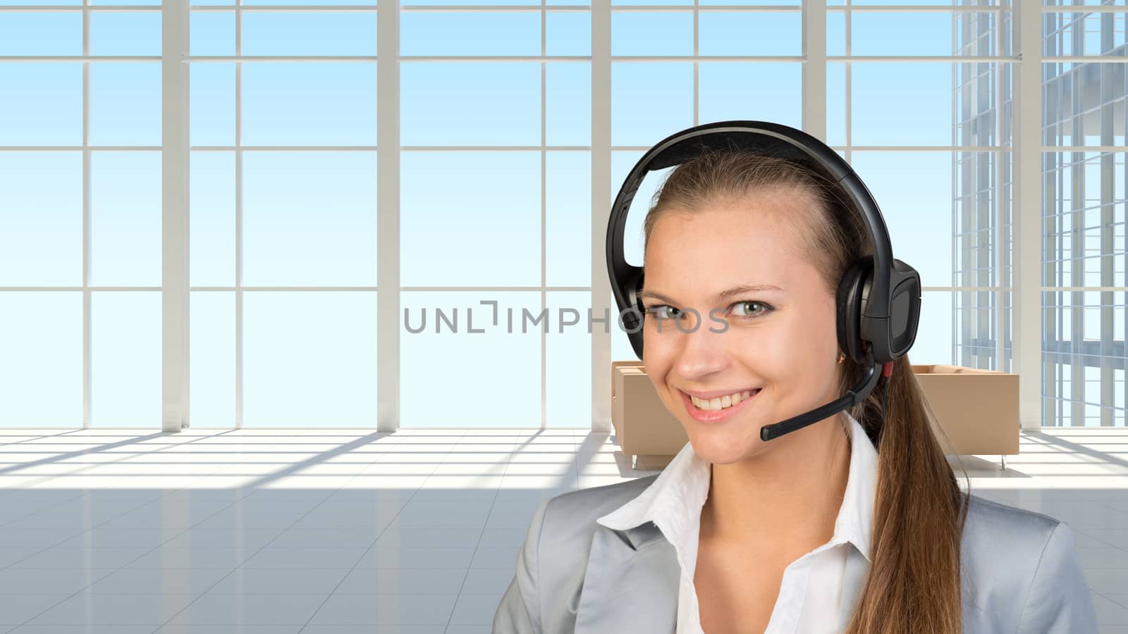 Businesswoman in headset, interior with transparent wall by cherezoff