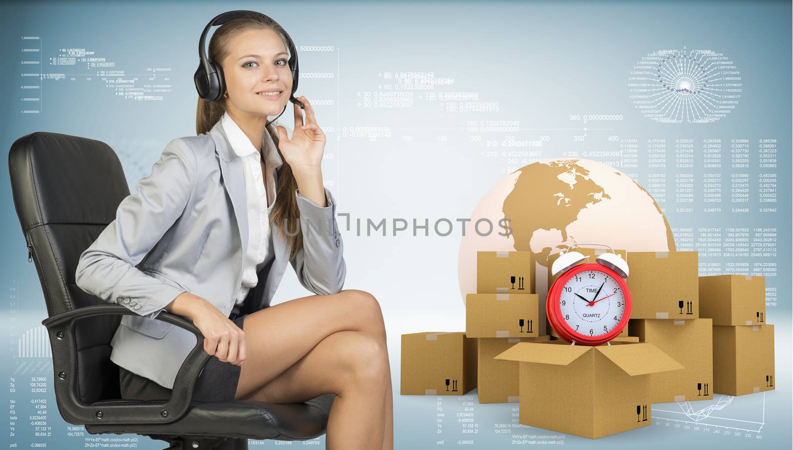 Businesswoman in headset, sitting on office chair, her hand on microphone, sitting, looking at camera, smiling. Beside are globe, commodity boxes and alarm-clock on top of one. Graphs and other virtual elements as backdrop. Element of this image furnished by NASA