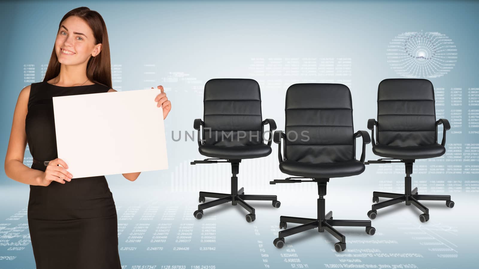 Businesswoman holding blank white paper sheet, looking at camera, smiling. Three office chairs beside. Hi-tech graphs as backdrop