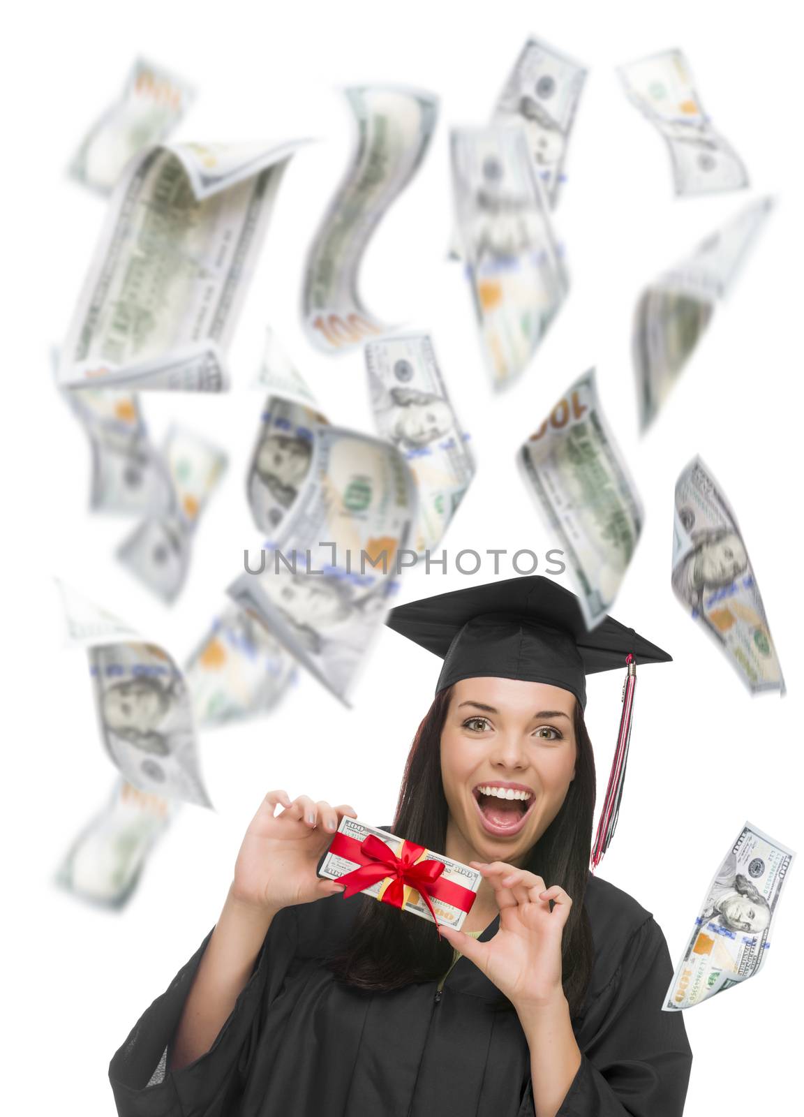 Excited Female Graduate in Cap and Gown Holding Stack of $100 Bills with Many Falling Around Her on White.