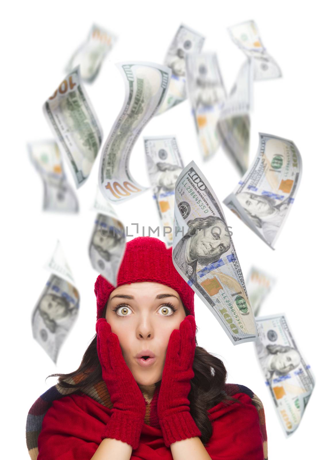 Young Excited Warmly Dressed Woman with $100 Bills Falling Money Around Her on White.