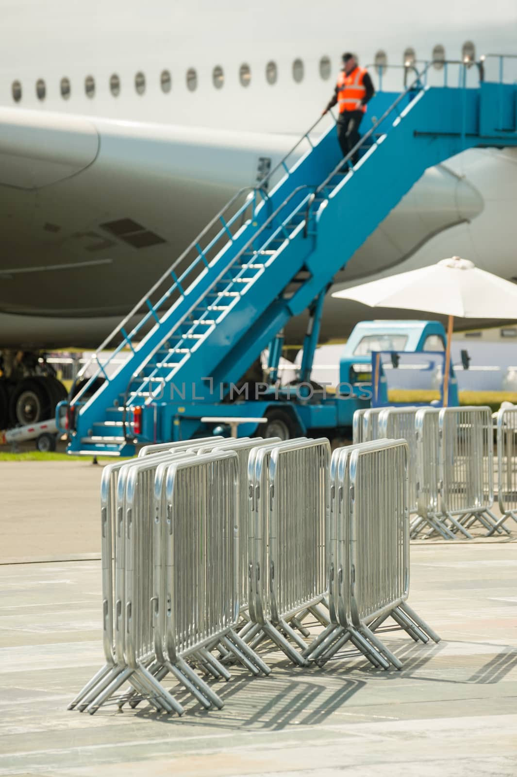 metal fencing barriers used to control the flow of passengers at an airport