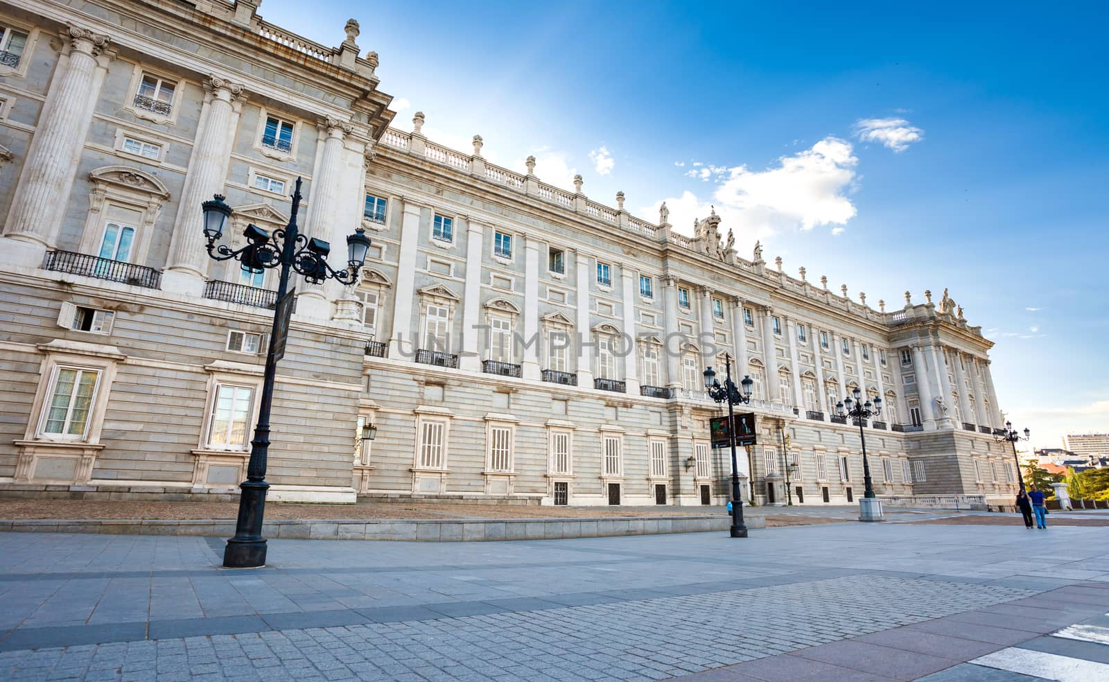 Madrid, Spain - May 6, 2012: Royal palace (Palacio Real de Madrid) with tourists on spring day in Madrid, Spain