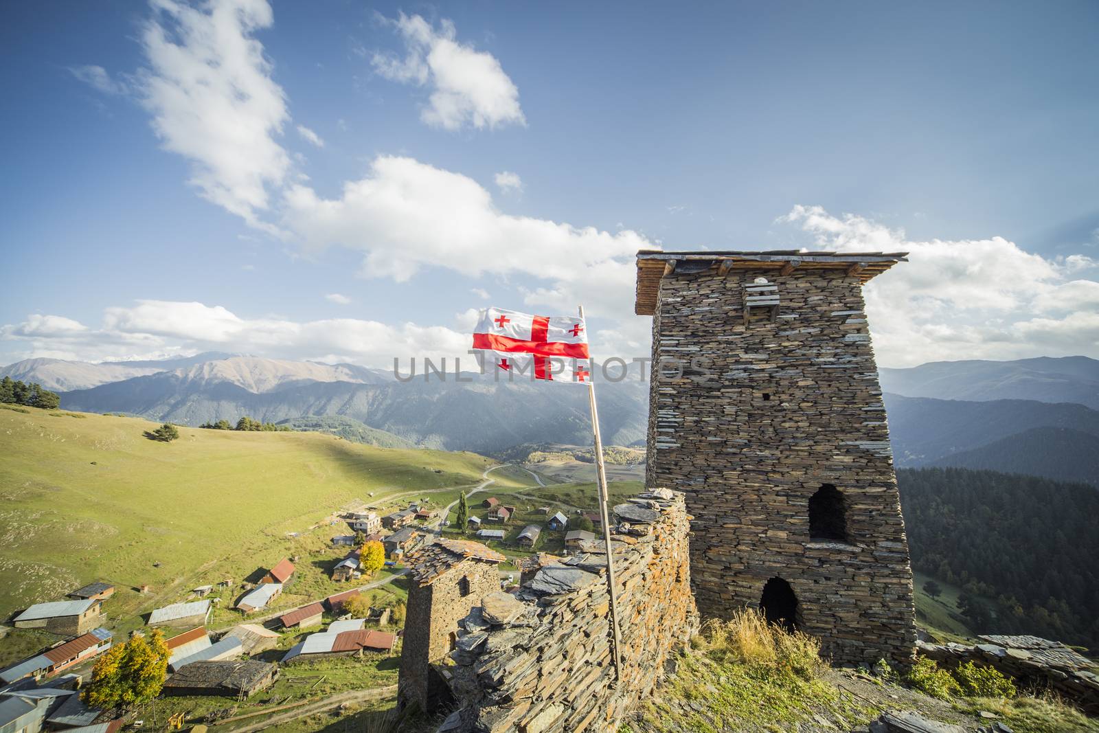 Georgia flag mountain village towers tourism by Kor