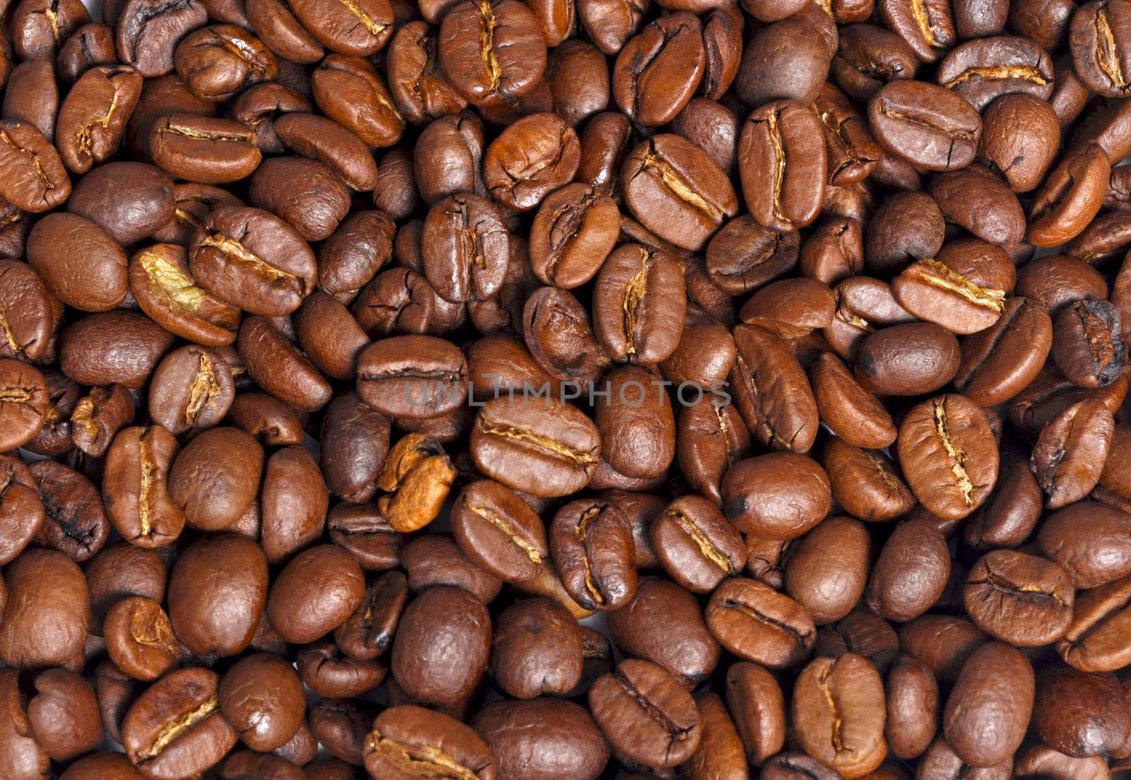 Dark coffee beans textured background